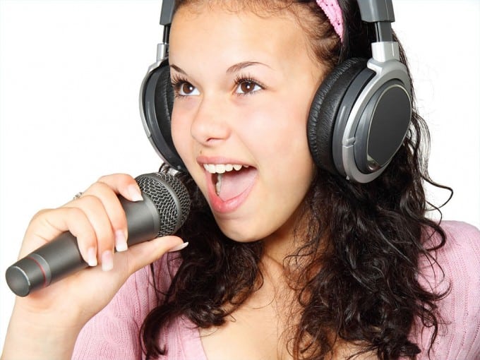 girl-holding-karaoke-mic-microphone-music-singer