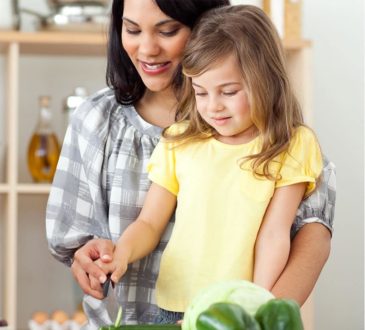 Mom Cooking with baby girl