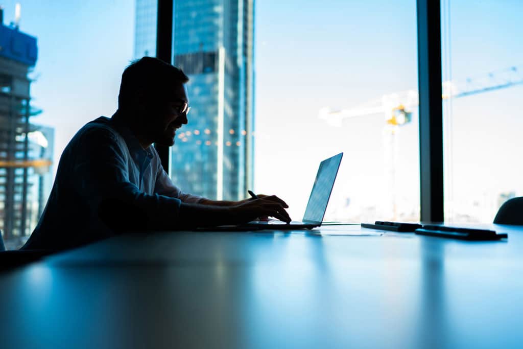 sitting at table desktop in office